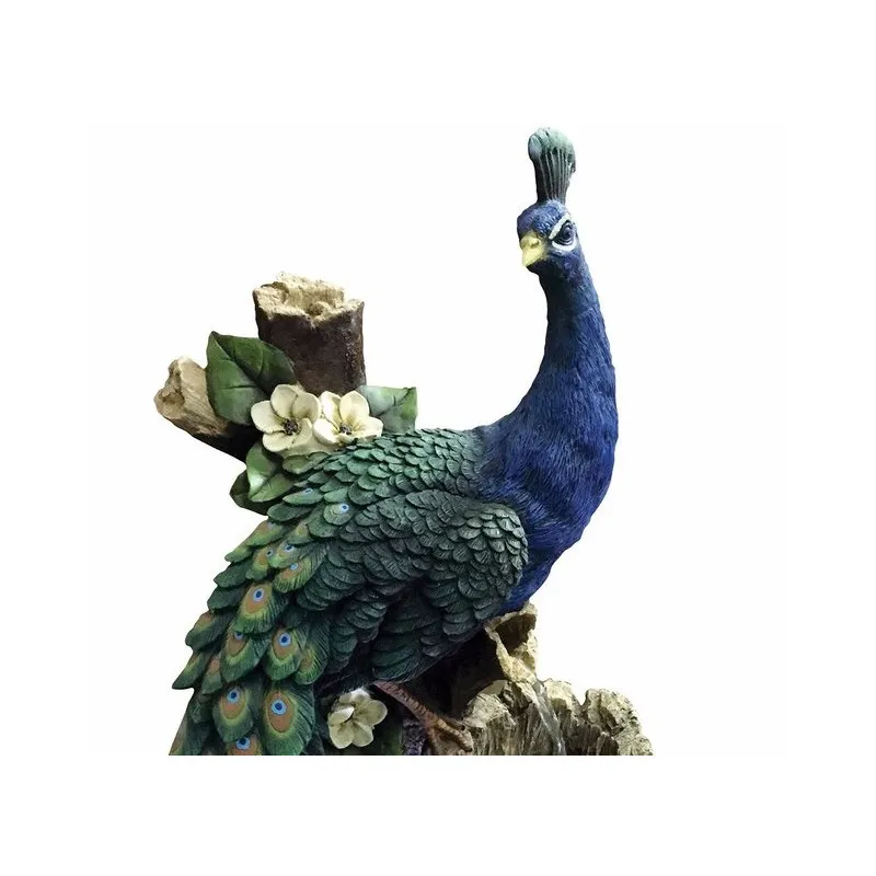 Peacock on a tree trunk